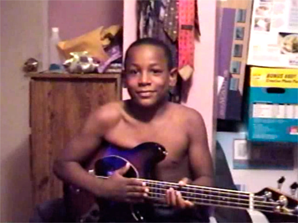 J'den Cox playing guitar as a kid